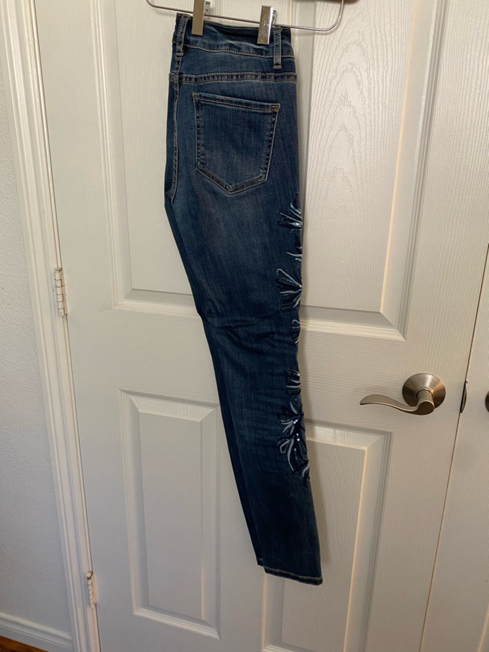 Cartoon Brand Indigo Skinny Jeans with Embroidery and Embellishments.